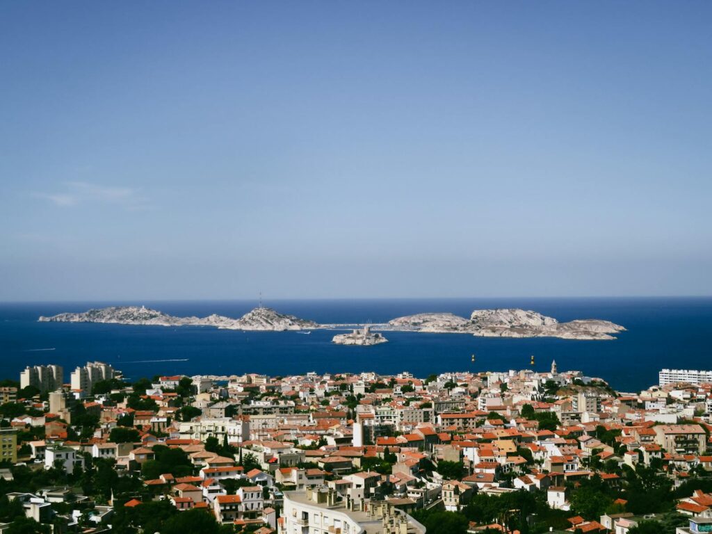Stunning aerial view of Marseille's coast with the Frioul Archipelago under clear blue skies.